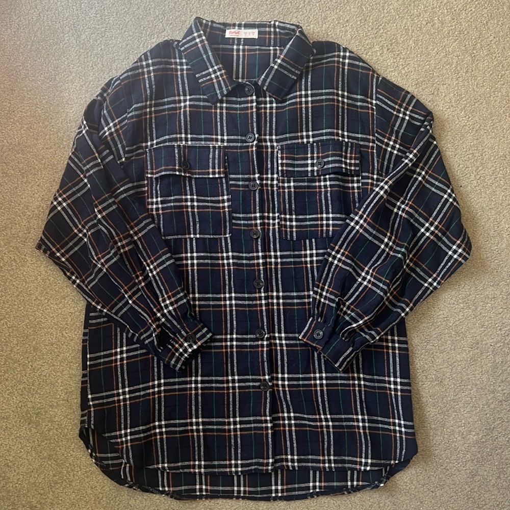 Navy, orange, white, and green flannel